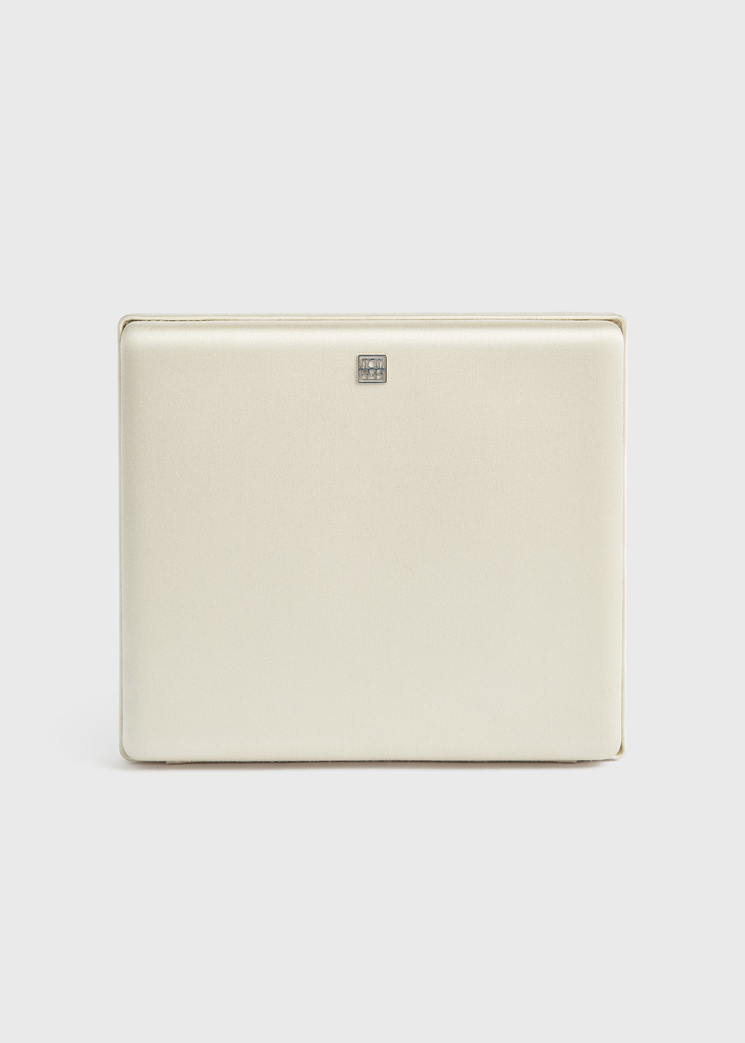 Satin box clutch ecru from Toteme - $750