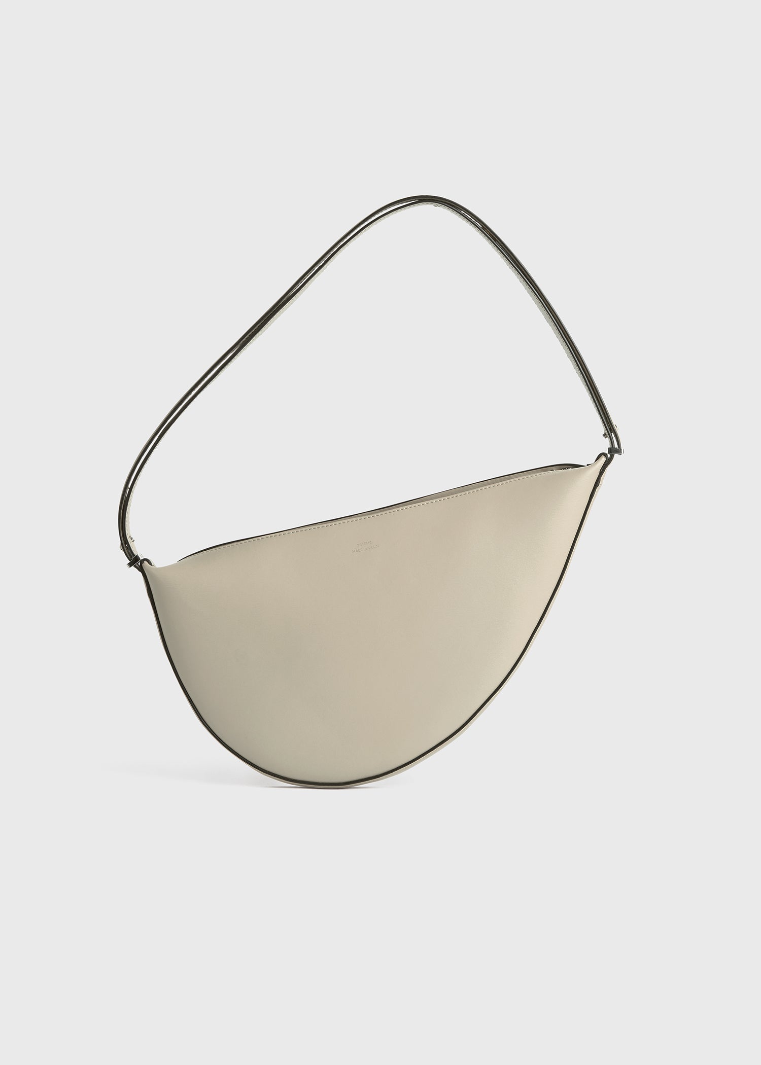 Leather scooped sling fawn from Toteme - $534