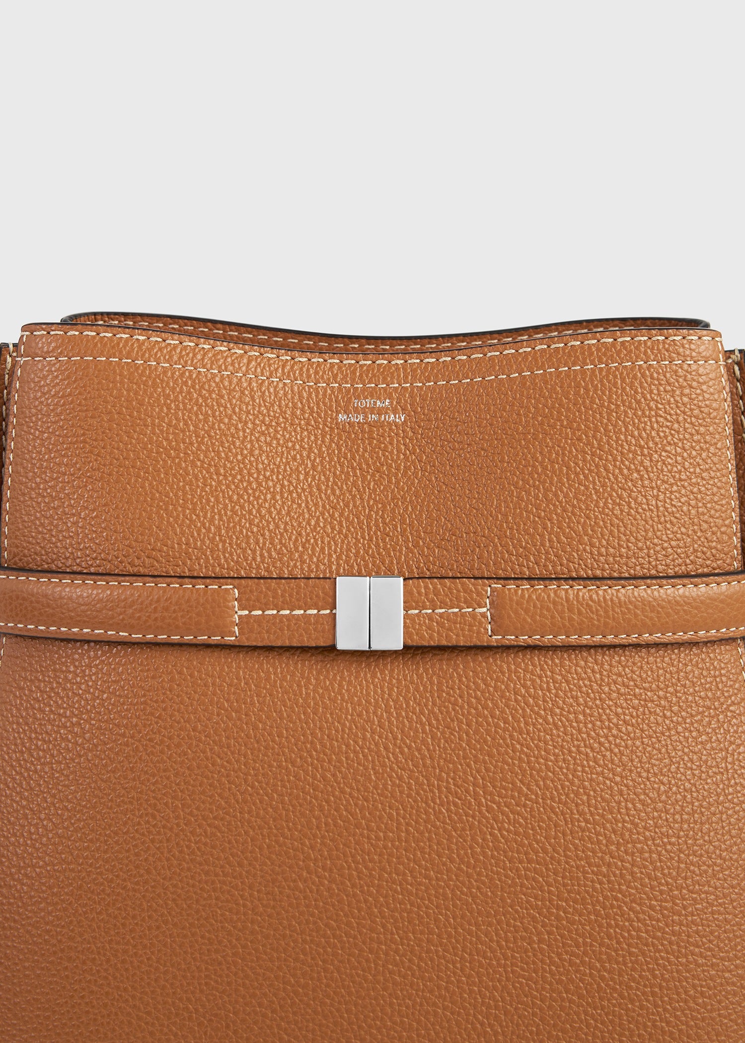 Belted grained-leather bucket bag tan