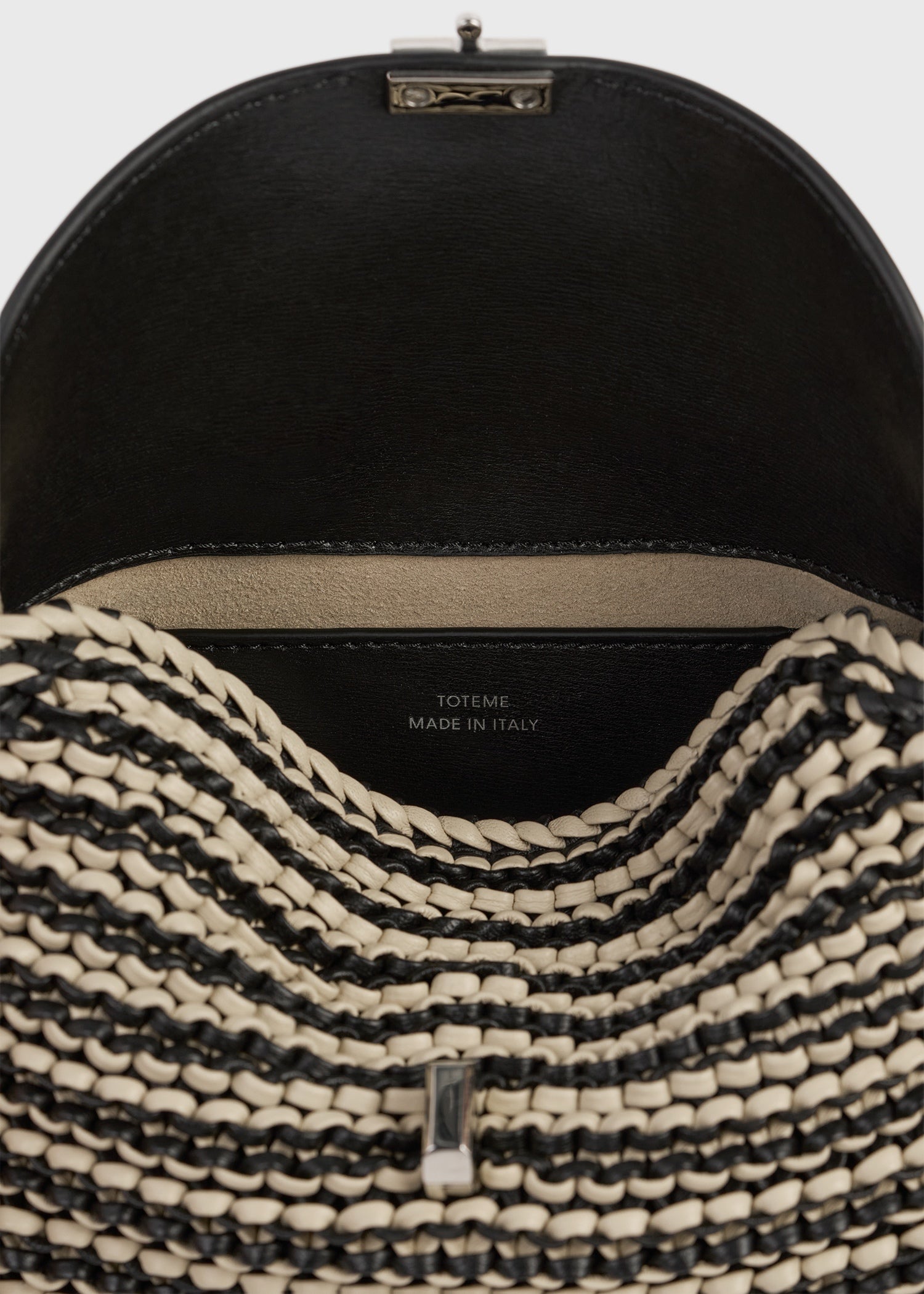 Mini T-lock woven-leather clutch black/sand