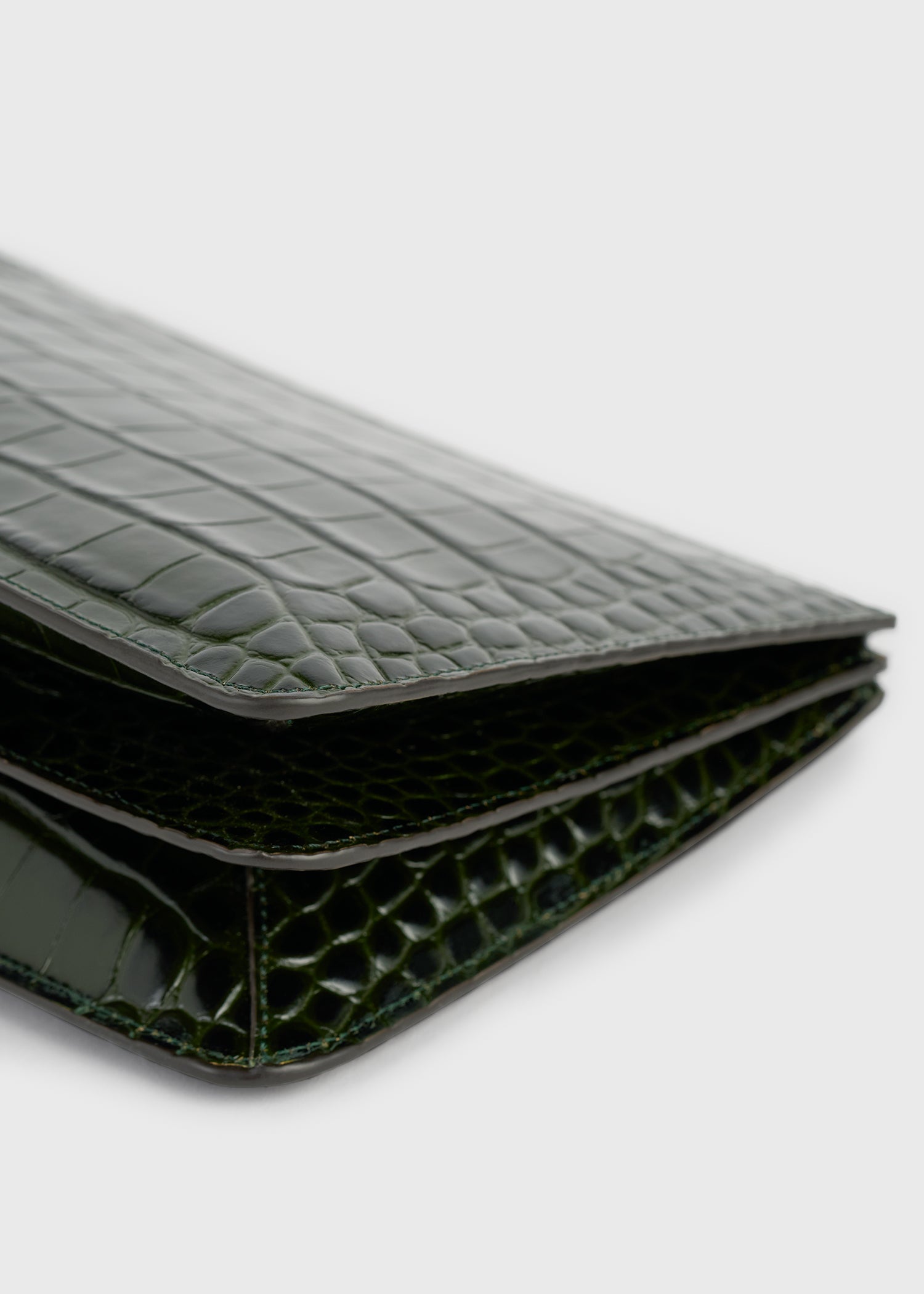 Threefold croco-embossed clutch dark green
