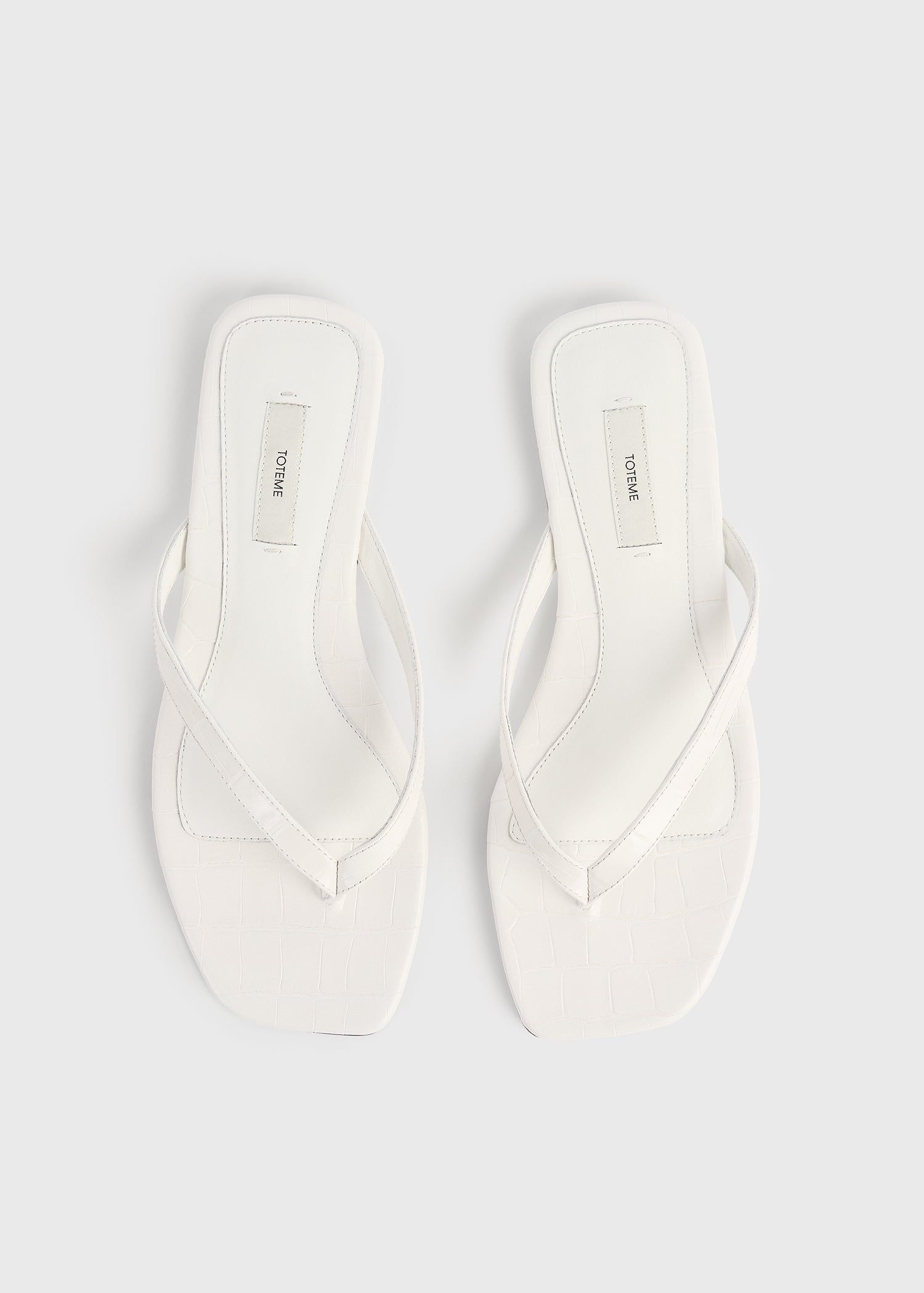 Croco-embossed flip flops off-white – TOTEME