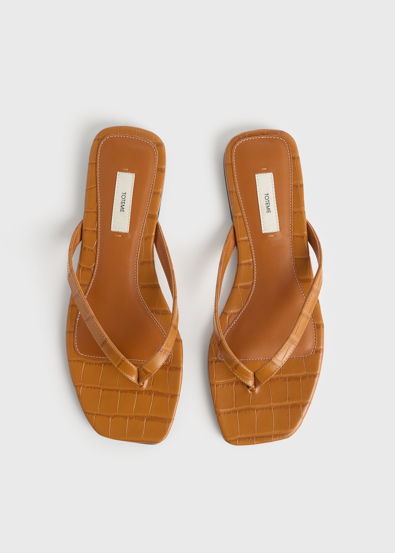 Croco-embossed flip flops tangerine – TOTEME