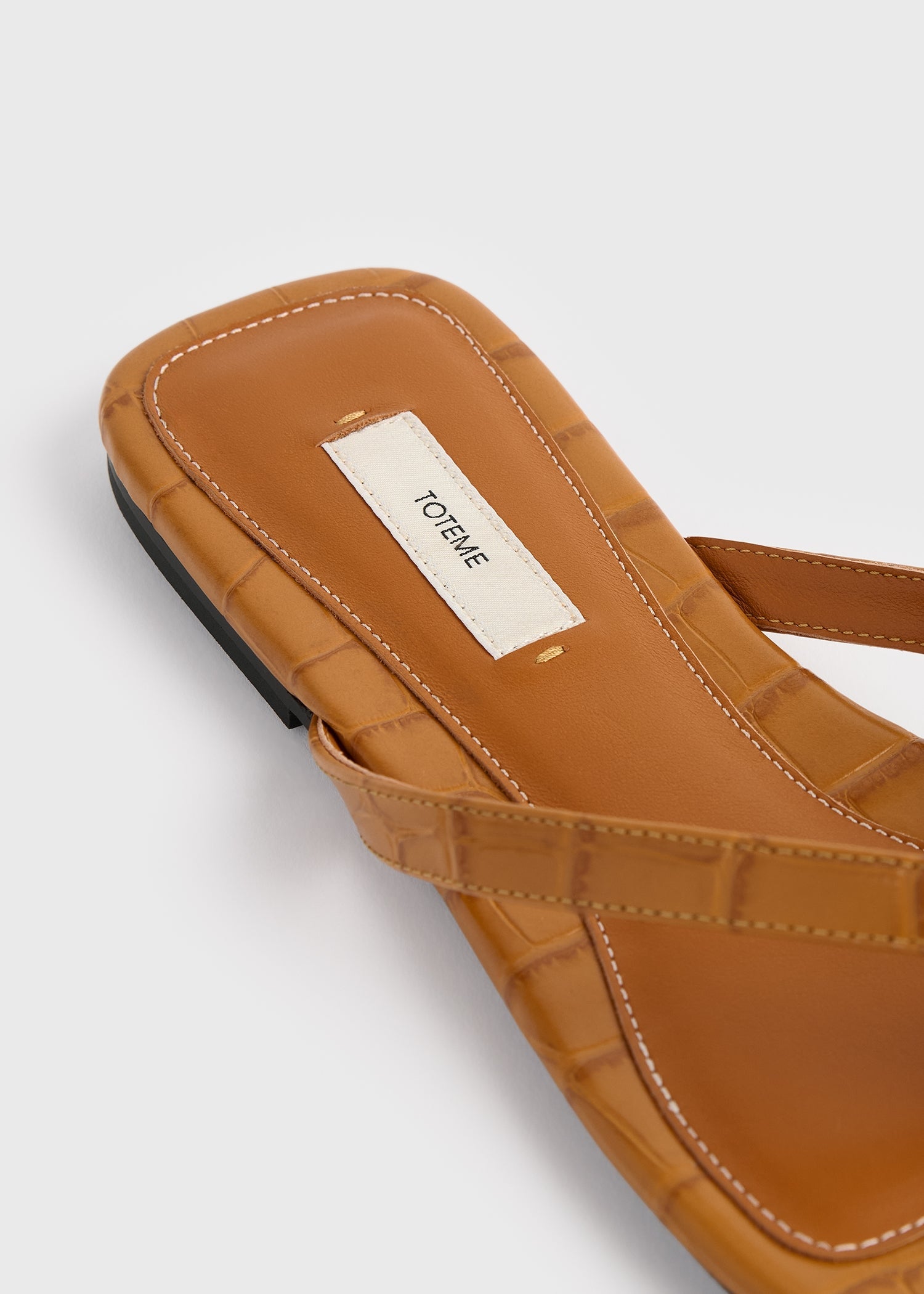 Croco-embossed flip flops tangerine