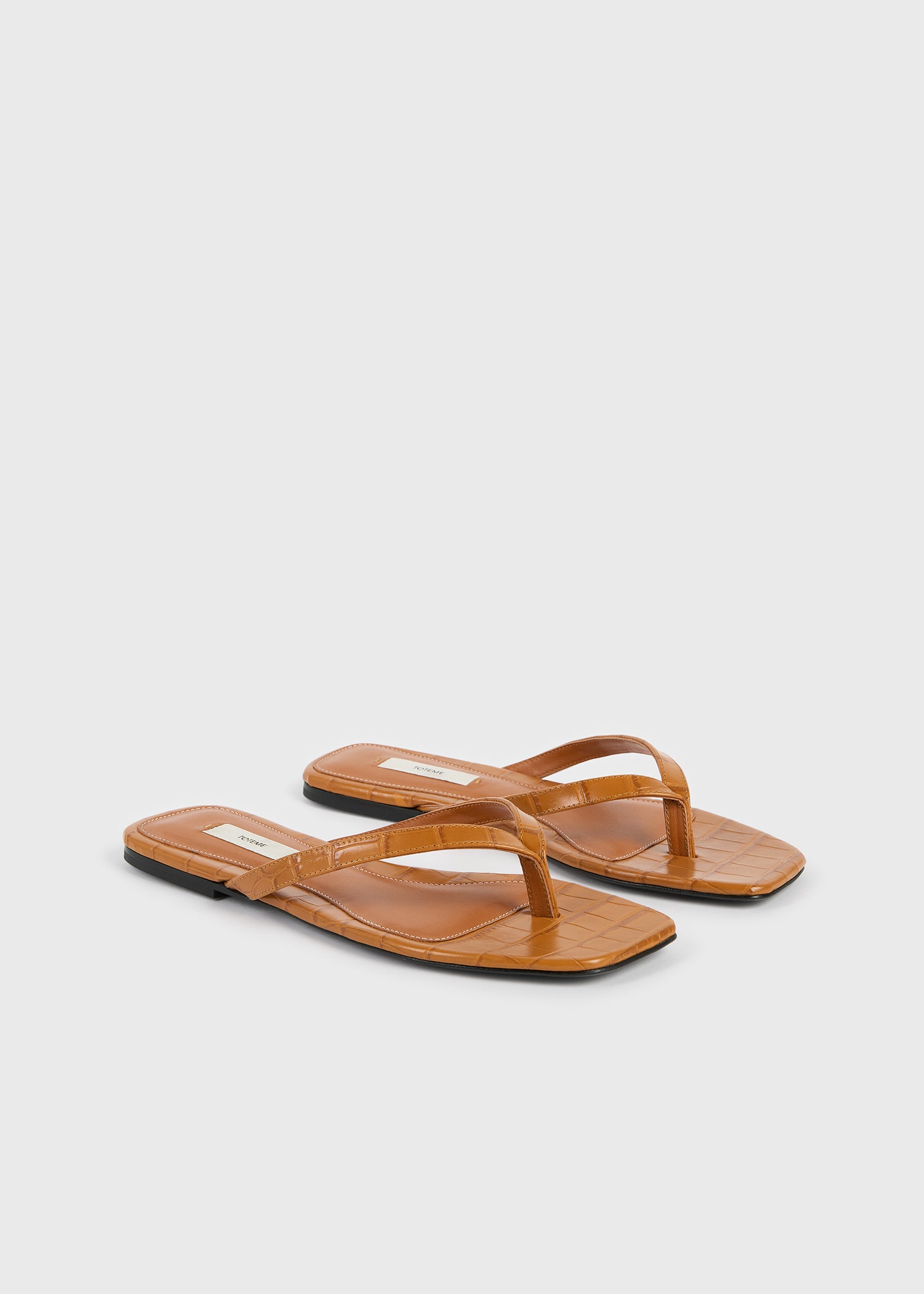 Croco-embossed flip flops tangerine – TOTEME