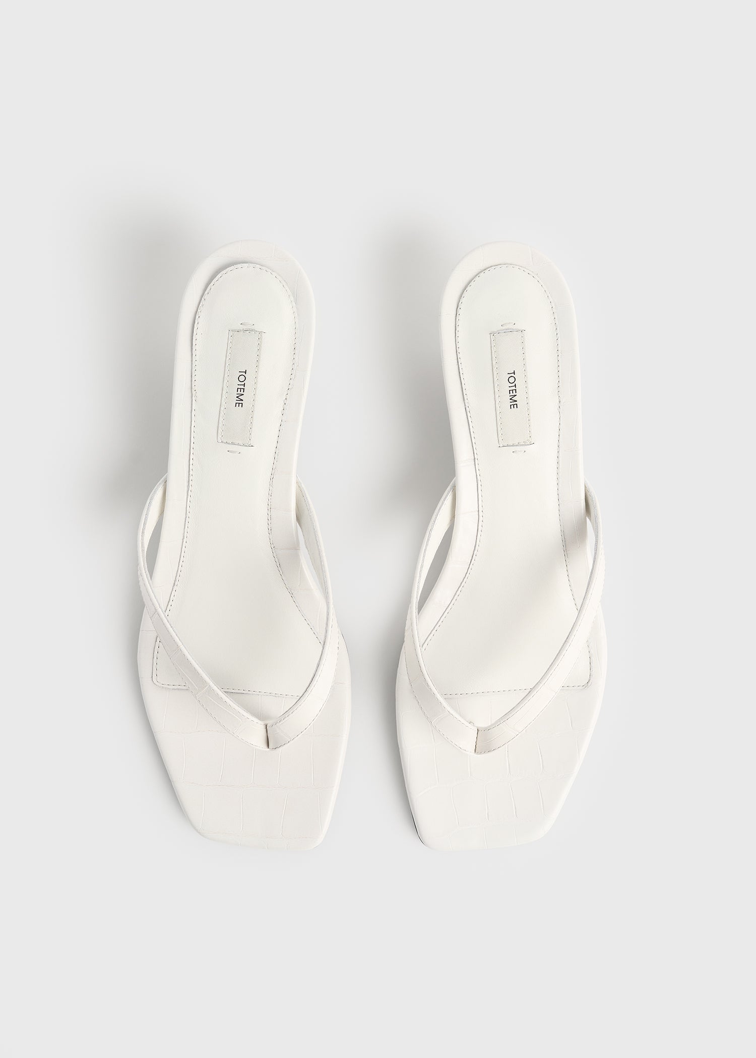 Croco-embossed heeled flip flops off-white