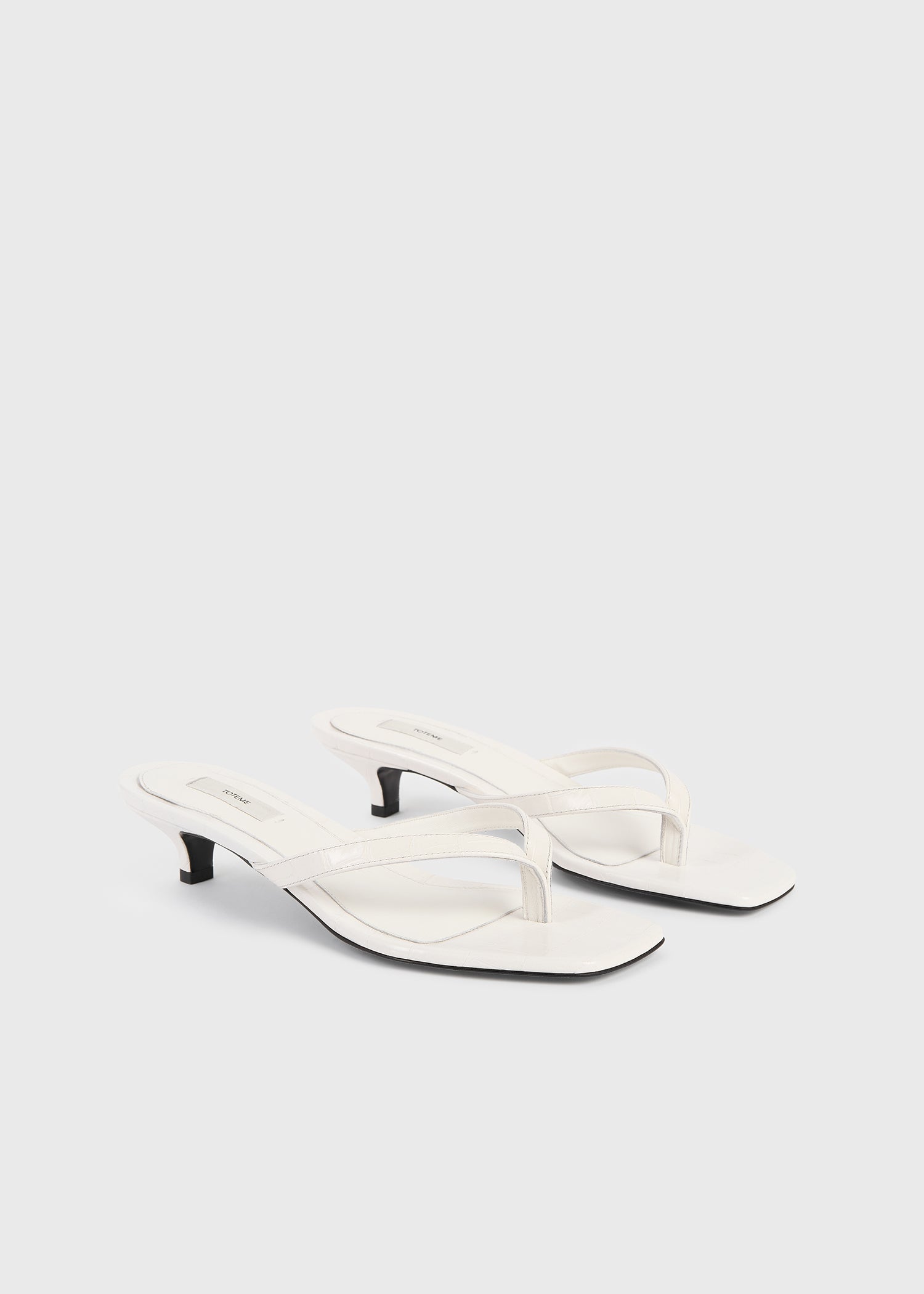 Croco-embossed heeled flip flops off-white