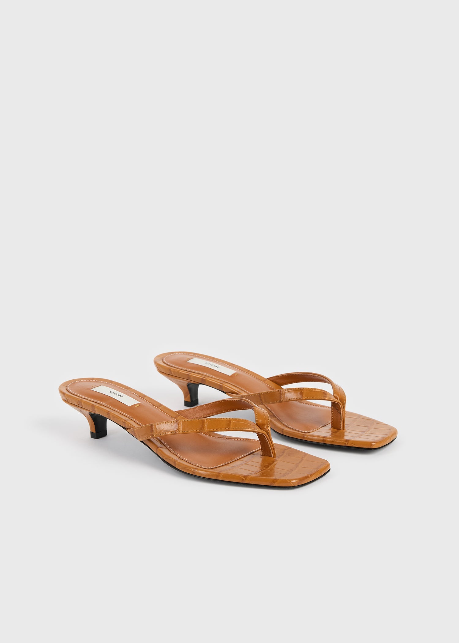 Croco-embossed heeled flip flops tangerine