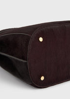 Belted pony hair bucket bag wine