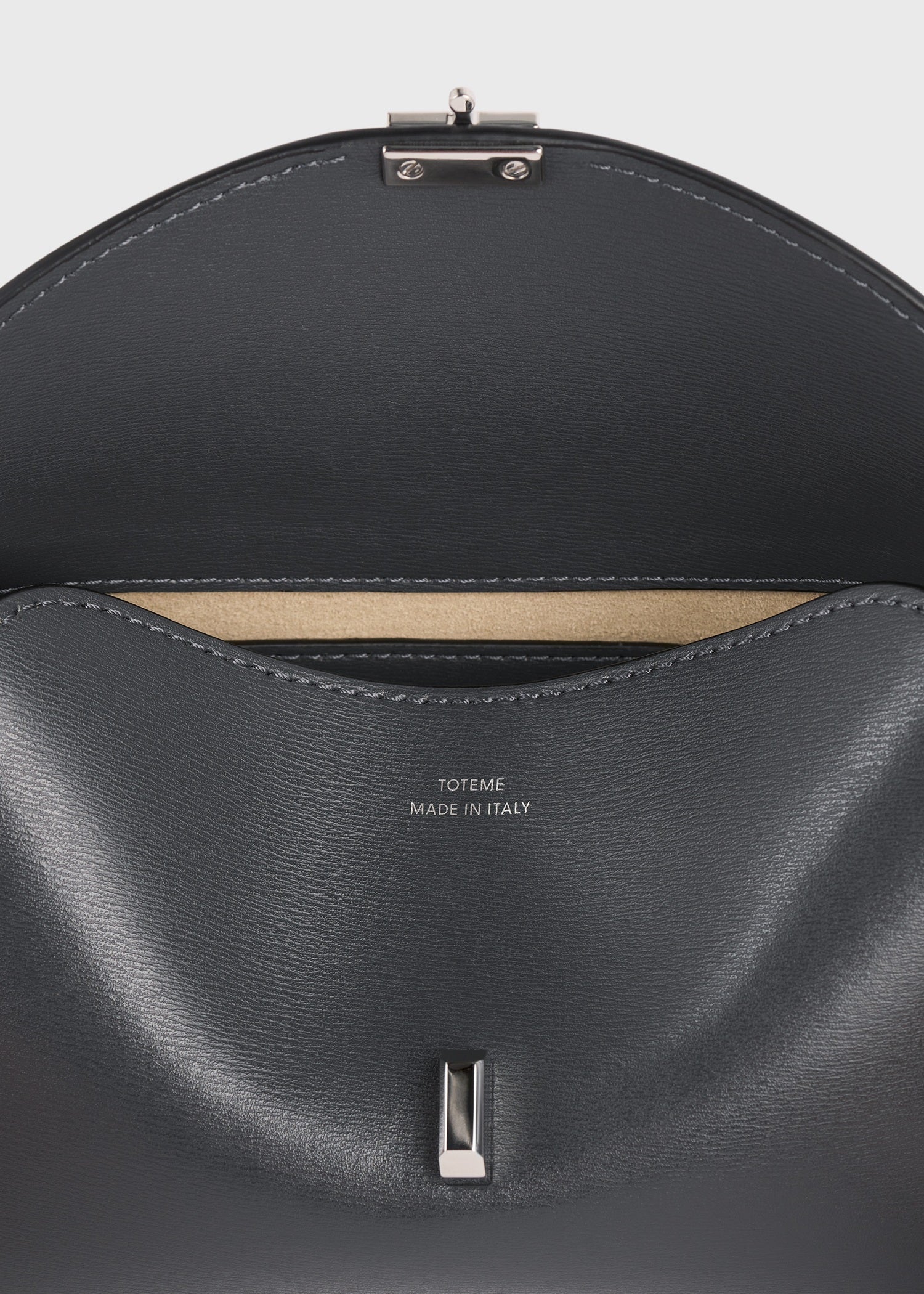 Mini T-lock leather clutch shark – TOTEME