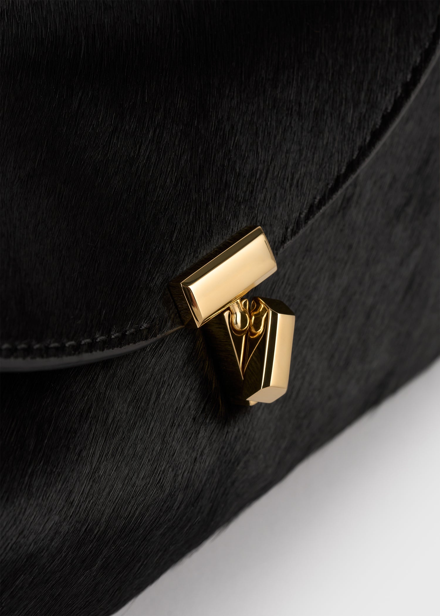 Mini T-lock pony hair clutch black