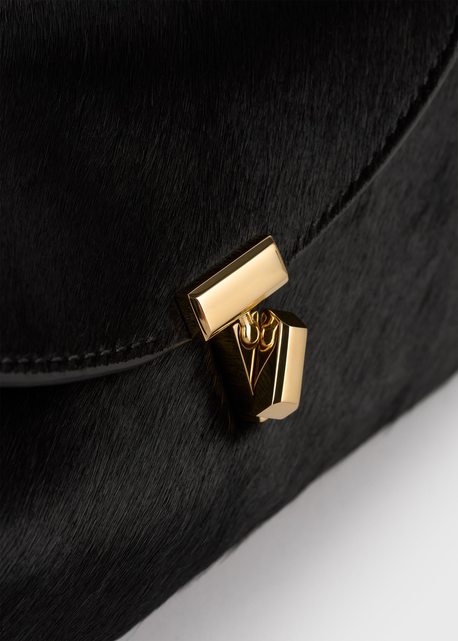 Mini T-lock pony hair clutch black