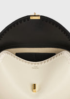 T-lock embroidered leather clutch black/milk