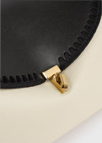 T-lock embroidered leather top handle black/milk