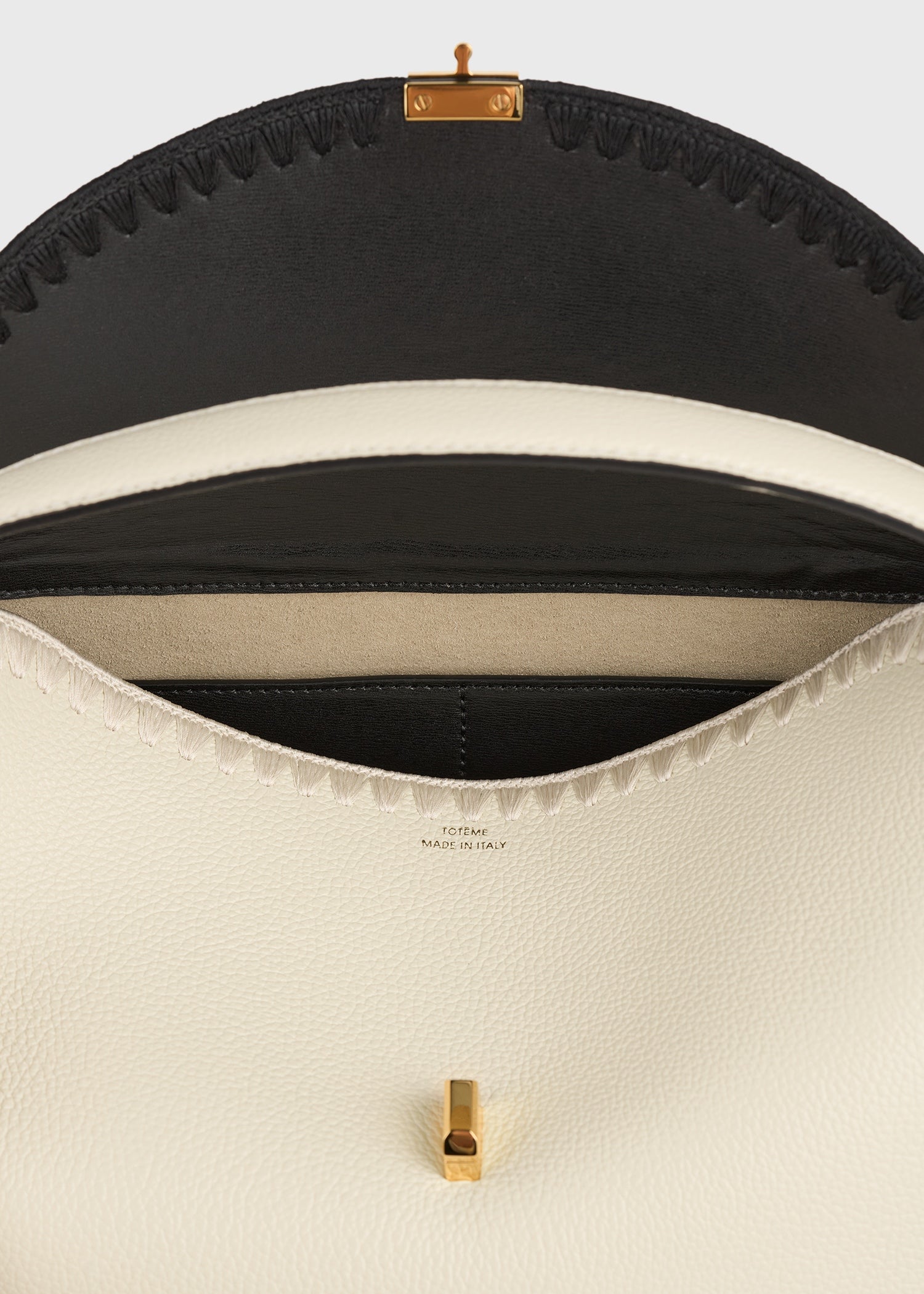 T-lock embroidered leather top handle black/milk