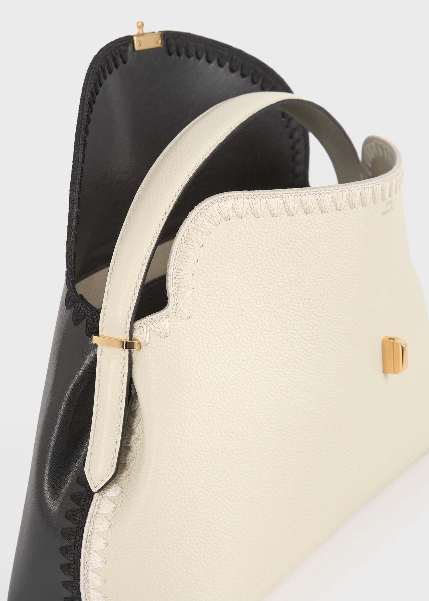 T-lock embroidered leather top handle black/milk