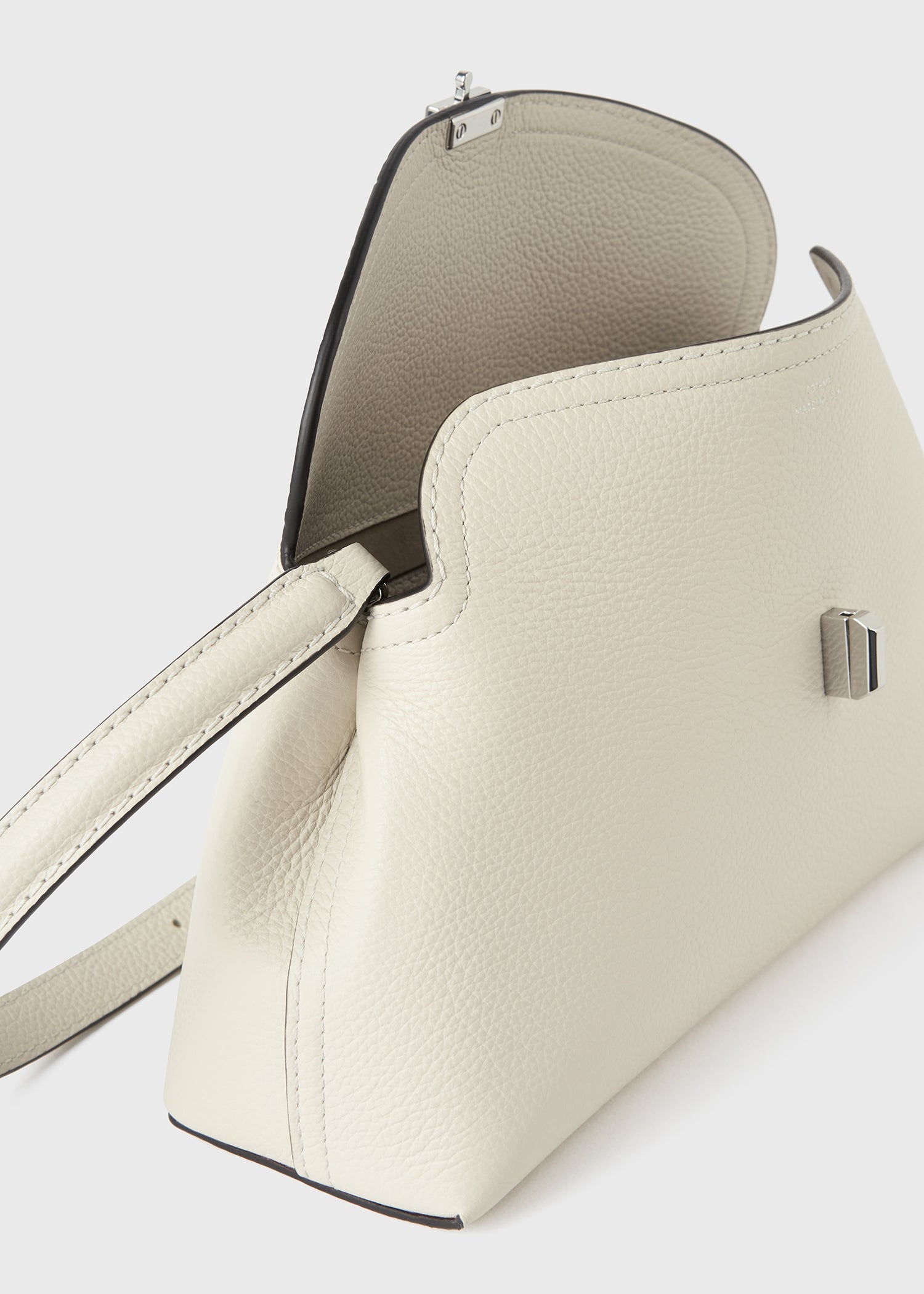 T-lock grained-leather clutch milk – TOTEME