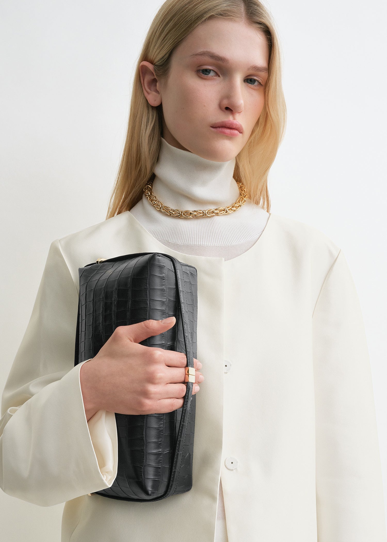 Belted croco-embossed clutch black