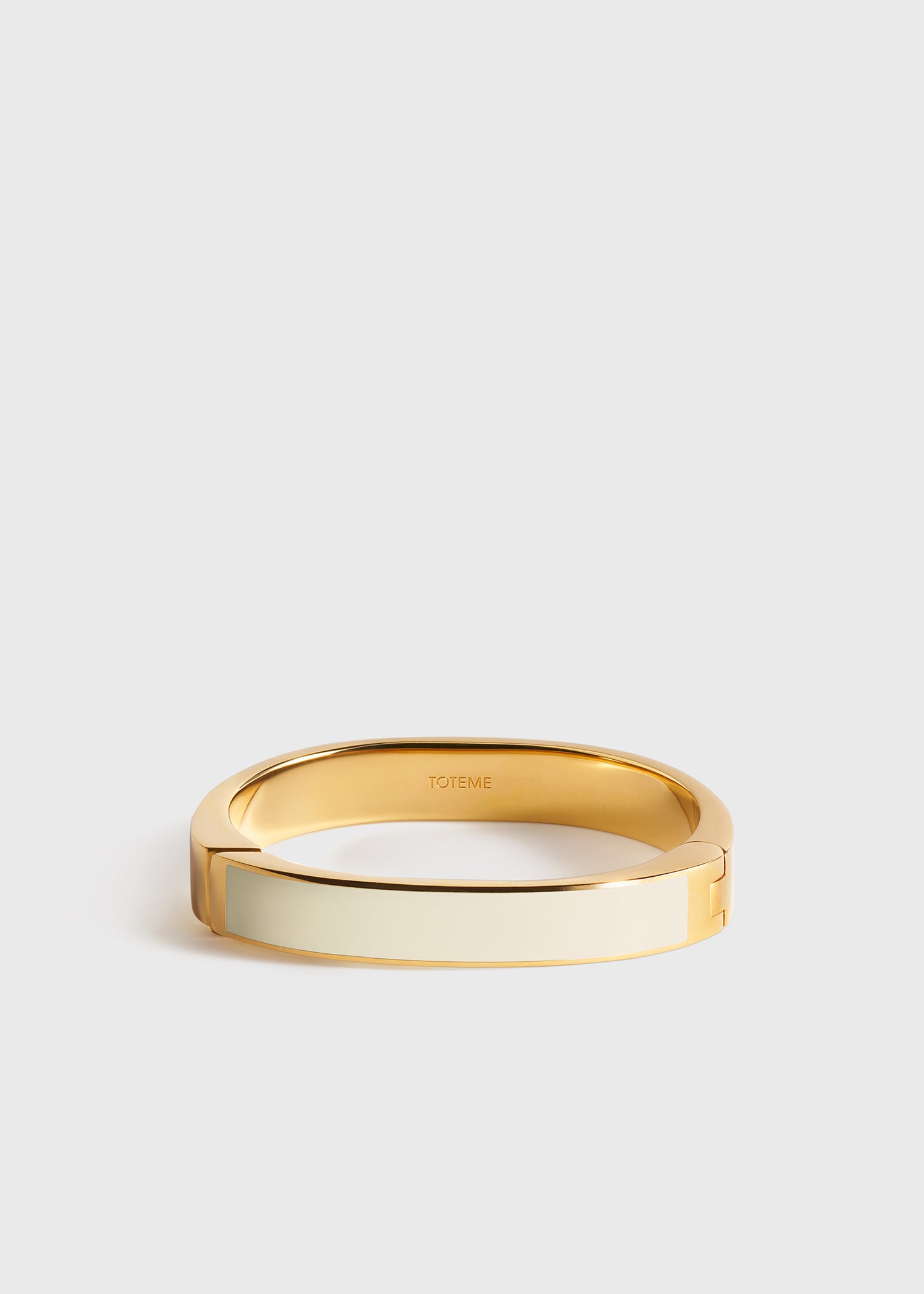 Signature bracelet ecru/gold from Toteme - $490