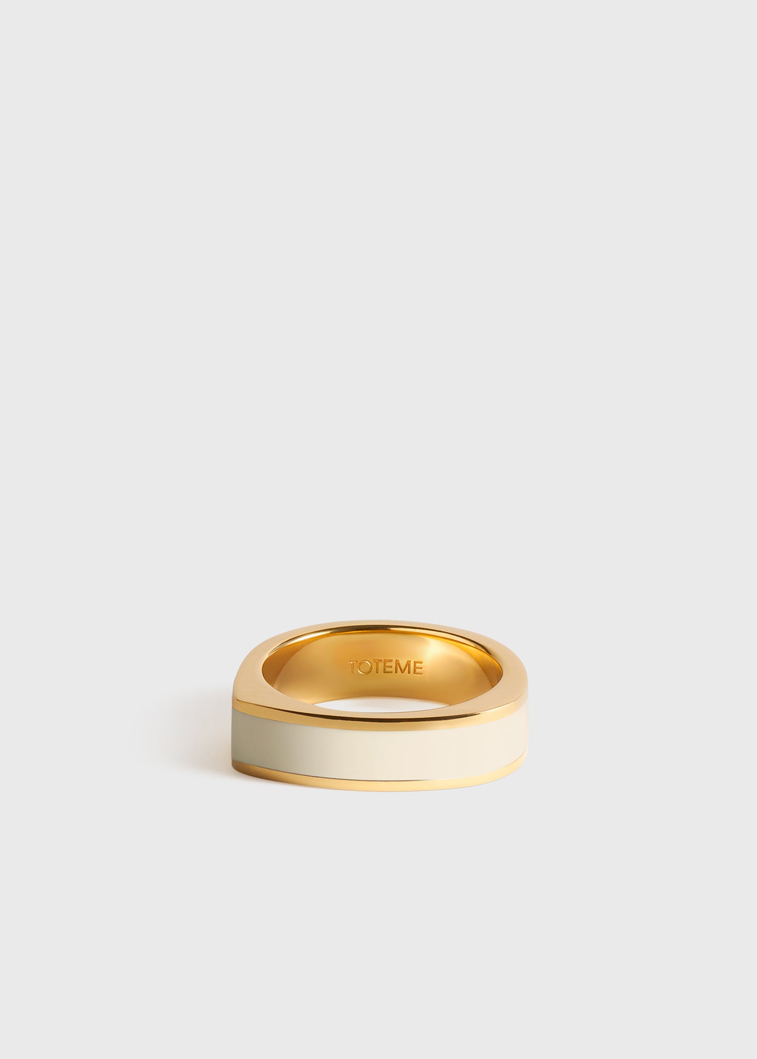Signature ring ecru/gold from Toteme - $320