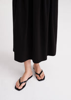 Croco-embossed flip flops black